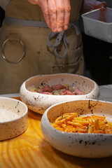 Penne pasta with prosciutto, black truffle, and olive oil