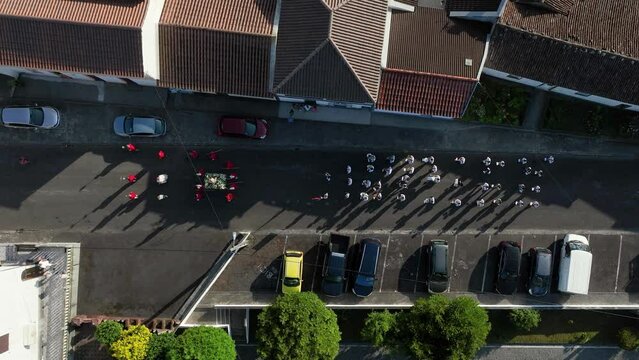 Religious Easter parada proceeding down street in Algarvia, Nordeste. Top aerial