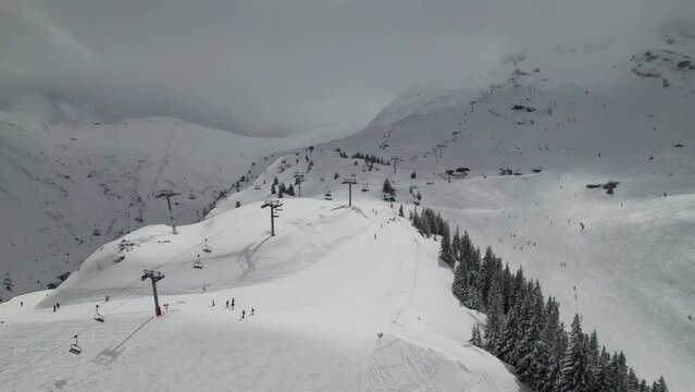 Chairlifts at busy ski resort in the French Alps. Portes du Soleil and Avoriaz 1800 resorts. Beautiful snowy mountains.