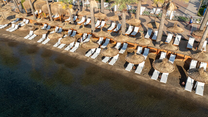 Beautiful seashore vacation on nature landscape background. beach resort with umbrellas with palm trees.