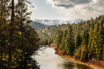 Montana river scene with snowy mountains