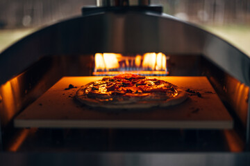 Pizza cooking in a pizza oven