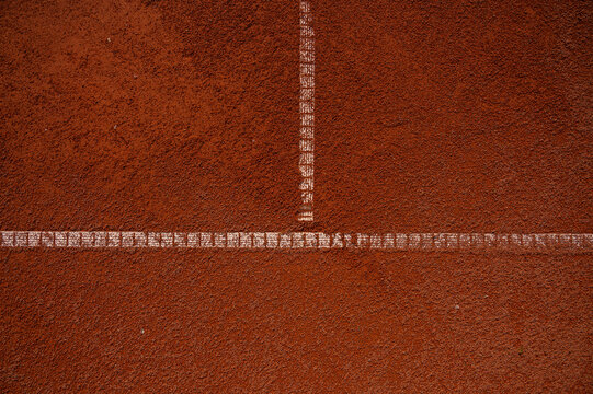 Horizontal tennis service line on red clay court