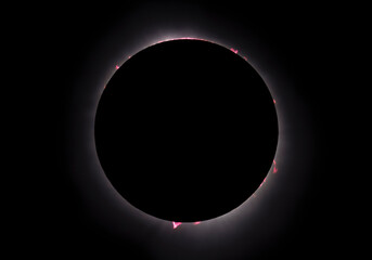 Composite early and late totality photograph displays the prominences, filaments, and flares as the moon blocked the sun during the April, 2024 total solar eclipse.
