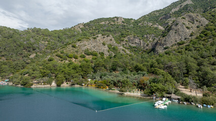 Obraz premium Tropical summer beach club. Beautiful sea near beach club. amazing nature sea and green