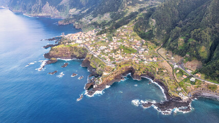 The picturesque village of Seixal in Madeira, nestled between green mountains and the azure ocean,...
