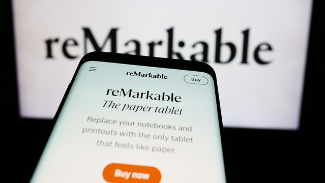 Stuttgart, Germany - 03-28-2024: Smartphone with website of Norwegian e-reader company reMarkable AS in front of business logo. Focus on top-left of phone display.