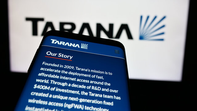 Stuttgart, Germany - 03-28-2024: Mobile phone with website of US telecommunications company Tarana Wireless Inc. in front of business logo. Focus on top-left of phone display.