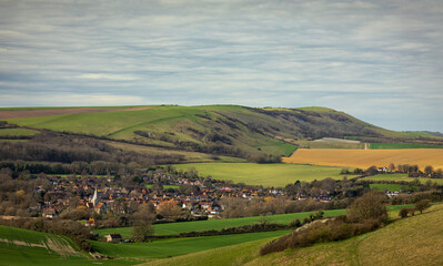 View of Alfristion village and the south downs from Wilmington Hill east Sussex south east England...