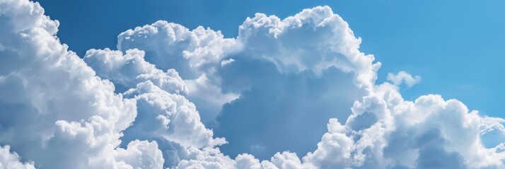 Vibrant Blue Sky Adorned with Fluffy White Clouds