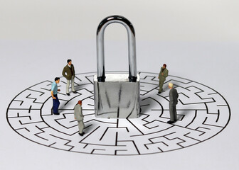 Lock and business miniatures in the maze. Privacy concepts, business, and security concepts.
