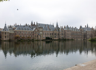 Facade of Binnenhof - Dutch Parliament with Hofvijver pond, The Hague, The Netherlands;