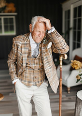 Reflective Moment: Elderly Gentleman in Plaid, Embracing Memories with a Sigh, Timeless Elegance and Grace