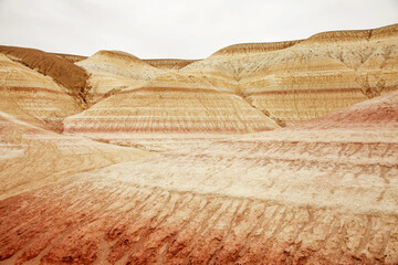 Unique geological feature known as tiger-striped mountains, showcasing layers of sedimentary rock...