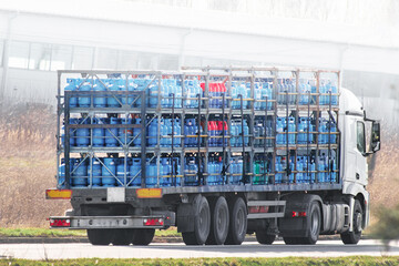 Commercial Gas Cylinder Delivery Service. Efficient LPG Cylinder Distribution on Roadways. Blue...