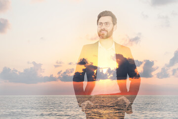 Double exposure of handsome businessman and sea at sunset