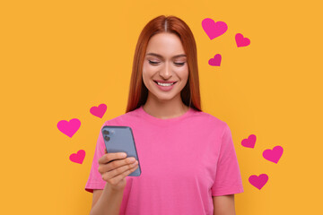 Long distance love. Woman chatting with sweetheart via smartphone on golden background. Hearts...
