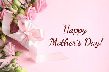 Happy Mother's Day greeting card. Beautiful flowers and gift box on pink background