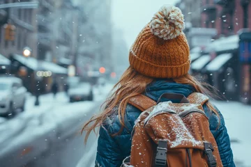 Foto op Plexiglas Woman walking in snow-covered city © gearstd