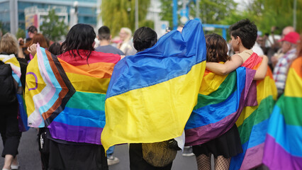 Bi girl wave Ukrainian flag. Stop homophobia fest. Same sex love. Joy women have fun lgbt pride...