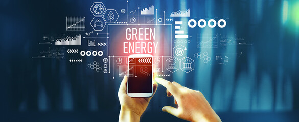 Green Energy concept with person using a smartphone - 781914947