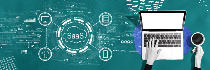 SaaS - software as a service concept with person using a laptop computer - 781916379