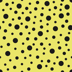 Beautiful abstract memphis style random circles, pastel yellow and black color, trendy modern seamless pattern