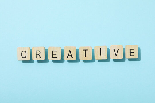 The word: "creative" laid out in letters on a blue background.