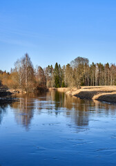 River in the woods and fields