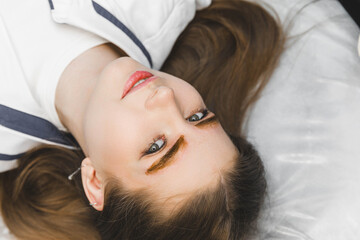 Fototapeta premium A cosmetologist applies permanent makeup to the eyebrows - eyebrow tattoo. eyebrow perm