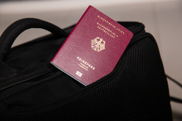 Close up of a German passport in a black travel bag pocket