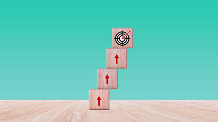 Target concept, objective, virtual target board and rising arrows screen printed on wooden cubes....