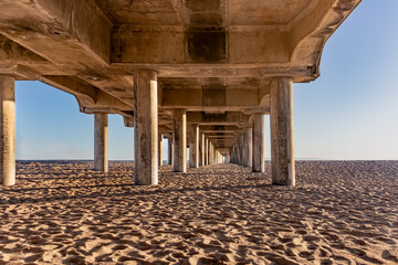 Entire Length of Underside of Huntington Beach Pier from Low Perspective with Blue Sky Behind, California, USA, horizontal-no people