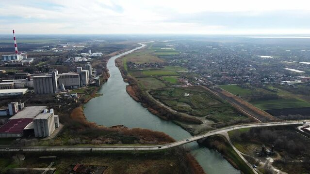 Aerial video of a bridge over Bega river in industrial district of Zrenjanin