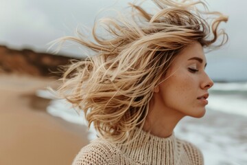 Serene Woman Embracing Sea Breeze on Beach with Flowing Hair
