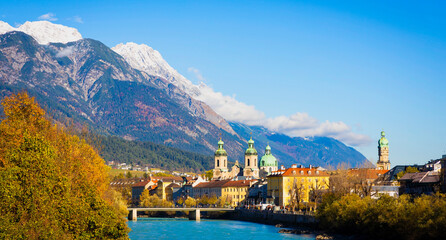 Panorama view of  Innsbruck  as city center town with beautiful houses, river Inn and Tyrol Alps, Austria