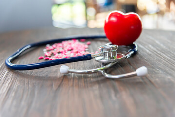 Pill with stethoscope and red heart shape concept of health care and medical.