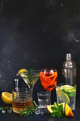 Set of alcoholic drinks (vodka, whiskey, aperol spritz, martini, lemon mojito ) on the bar counter. - 781938944