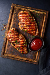 Grilled spicy chicken breasts. Top view with copy space. - 781939372