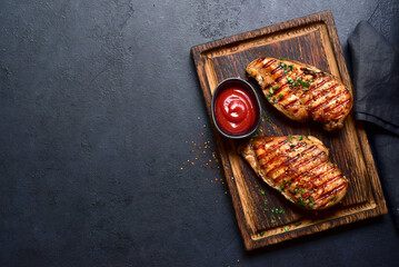 Grilled spicy chicken breasts. Top view with copy space. - 781939794