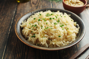 A bowl with traditional German Sauerkraut served in rustic style