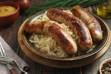 A bowl with Bratwurst and Sauerkraut as side dish - traditional German food