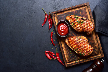 Grilled spicy chicken breasts. Top view with copy space. - 781940168