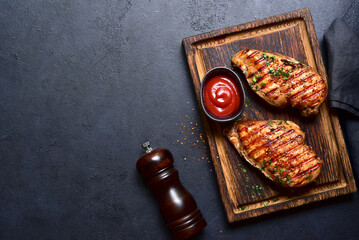 Grilled spicy chicken breasts. Top view with copy space. - 781940192
