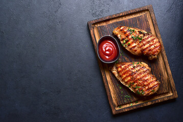 Grilled spicy chicken breasts. Top view with copy space. - 781940577
