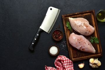 Raw chicken fillet or breasts with ingredients for cooking. Top view with copy space. - 781940780