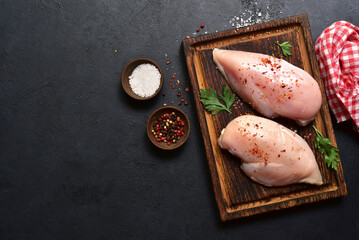 Raw chicken fillet or breasts with ingredients for cooking. Top view with copy space. - 781941120