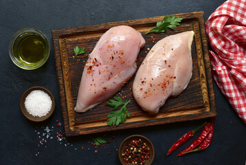 Raw chicken fillet or breasts with ingredients for cooking. Top view with copy space. - 781941188
