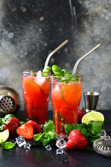 Cold summer strawberry cocktail with lime and basil in a  glasses . - 781941304