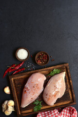 Raw chicken fillet or breasts with ingredients for cooking. Top view with copy space. - 781941379